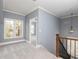 Upstairs landing area with a window and an open doorway at 232 Hunt Ne St, Marietta, GA 30060