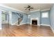 Bright living room with fireplace, hardwood floors, and a staircase at 232 Hunt Ne St, Marietta, GA 30060
