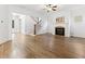 Bright living room with fireplace, staircase, hardwood floors, and windows overlooking the front yard at 232 Hunt Ne St, Marietta, GA 30060