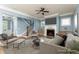 Cozy living room featuring a fireplace, ceiling fan, and plenty of natural light at 232 Hunt Ne St, Marietta, GA 30060