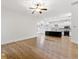 Open-concept living room flows into kitchen featuring hardwood floors and abundant natural light at 232 Hunt Ne St, Marietta, GA 30060