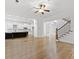Bright open-concept living area with kitchen, and stairs, featuring hardwood floors and abundant natural light at 232 Hunt Ne St, Marietta, GA 30060