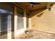 Covered patio area with stone flooring, exterior siding, ceiling fan and natural light at 232 Hunt Ne St, Marietta, GA 30060