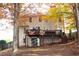 Backyard view of the house with a spacious back deck and lots of trees at 912 Tanners Point Dr, Lawrenceville, GA 30044