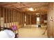 Unfinished basement with exposed beams, wiring and lighting, a blank canvas ready for customization at 912 Tanners Point Dr, Lawrenceville, GA 30044