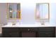 Bright bathroom features a double sink vanity, with framed mirrors and sleek fixtures at 912 Tanners Point Dr, Lawrenceville, GA 30044