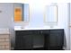 Bathroom vanity with double sinks, granite countertop, and sleek black cabinets at 912 Tanners Point Dr, Lawrenceville, GA 30044