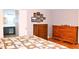 Bedroom with wood floors featuring two dressers and ensuite bathroom at 912 Tanners Point Dr, Lawrenceville, GA 30044