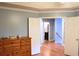 Bedroom featuring two closets with neutral paint and wood floors at 912 Tanners Point Dr, Lawrenceville, GA 30044