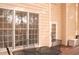 Outdoor deck view with dining table and door to interior at 912 Tanners Point Dr, Lawrenceville, GA 30044