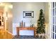 Elegant entryway with a charming console table, festive Christmas tree, and warm, inviting decor at 912 Tanners Point Dr, Lawrenceville, GA 30044