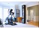 Home gym with exercise equipment, and a door leading to the front entry at 912 Tanners Point Dr, Lawrenceville, GA 30044
