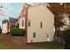 Two-story home showcases neutral siding and brick accents, set on a terraced lot with established greenery at 912 Tanners Point Dr, Lawrenceville, GA 30044