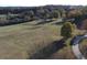 Expansive green space with mature trees, a walking path, and distant figures at 912 Tanners Point Dr, Lawrenceville, GA 30044