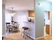 Kitchen view with bar top and bar stools, tile floor, and view to breakfast nook at 912 Tanners Point Dr, Lawrenceville, GA 30044