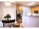 Bright kitchen with light cabinets, stainless refrigerator, and a view to the breakfast nook at 912 Tanners Point Dr, Lawrenceville, GA 30044