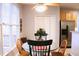 Eat-in kitchen nook with tile flooring, white framed windows and an accent wall hanging at 912 Tanners Point Dr, Lawrenceville, GA 30044