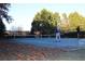 Outdoor tennis court with players engaged in a game at 912 Tanners Point Dr, Lawrenceville, GA 30044