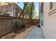 Fenced backyard includes stone area, brick and wood fence, and small landscape, perfect for outdoor activities at 281 15Th Ne St # 101, Atlanta, GA 30309