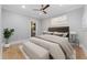Serene bedroom with comfortable bed, decorative touches, and a view into the ensuite bathroom at 281 15Th Ne St # 101, Atlanta, GA 30309