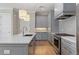 Well-equipped kitchen boasting ample storage, an island with seating, and modern appliances at 281 15Th Ne St # 101, Atlanta, GA 30309