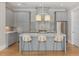 Modern kitchen featuring stainless steel appliances, a kitchen island, and stylish gray cabinetry at 281 15Th Ne St # 101, Atlanta, GA 30309