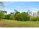 Green park with lush trees and a view of the city skyline in the background at 281 15Th Ne St # 101, Atlanta, GA 30309