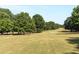 Expansive park featuring an open green space lined with trees, perfect for recreation and relaxation at 281 15Th Ne St # 101, Atlanta, GA 30309