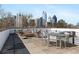Rooftop deck with outdoor seating offers breathtaking city views for relaxation and entertainment at 281 15Th Ne St # 101, Atlanta, GA 30309