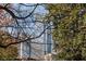 View of downtown buildings with bare winter tree branches framing the city skyline at 281 15Th Ne St # 101, Atlanta, GA 30309