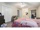 Bedroom featuring wood-look flooring, ceiling fan, closet, and ensuite bathroom at 1143 Forest Villa Nw Dr, Conyers, GA 30012