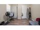 Bedroom featuring wood-look flooring, closet, and view of other rooms at 1143 Forest Villa Nw Dr, Conyers, GA 30012