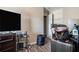 Bedroom featuring wood-look flooring, a small table, and a mounted television at 1143 Forest Villa Nw Dr, Conyers, GA 30012