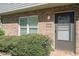 Charming front entrance with neatly trimmed bushes and visible house number at 1143 Forest Villa Nw Dr, Conyers, GA 30012