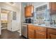 The kitchen boasts stainless steel appliances, wood cabinets and a double sink at 1143 Forest Villa Nw Dr, Conyers, GA 30012