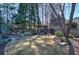 Picturesque backyard with mature trees, a gazebo, and a meticulously landscaped garden at 2160 Kensington Gates Nw Dr, Kennesaw, GA 30152