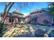 Beautiful backyard with a lush lawn, mature trees, and a stone waterfall feature at 2160 Kensington Gates Nw Dr, Kennesaw, GA 30152