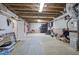 Unfinished basement with exposed ceiling, ample storage space, and potential for customization at 2160 Kensington Gates Nw Dr, Kennesaw, GA 30152