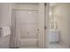 Bathroom view featuring tiled bathtub with shower and vanity sink at 2160 Kensington Gates Nw Dr, Kennesaw, GA 30152