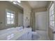 Bathroom featuring a window and vanity sink at 2160 Kensington Gates Nw Dr, Kennesaw, GA 30152