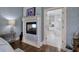 Ensuite bathroom featuring tile floors, fireplace, and access to the main bedroom at 2160 Kensington Gates Nw Dr, Kennesaw, GA 30152