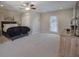Bright bedroom featuring a large bed, double closets, and access to the outdoors at 2160 Kensington Gates Nw Dr, Kennesaw, GA 30152
