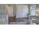 Bright bedroom features hardwood floors, double closets, and a built-in desk area near the window at 2160 Kensington Gates Nw Dr, Kennesaw, GA 30152