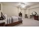 Bedroom with a wooden bed frame, neutral carpet, and a cozy atmosphere at 2160 Kensington Gates Nw Dr, Kennesaw, GA 30152