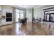 Open dining area features hardwood floors, a chandelier, and large windows offering ample natural light at 2160 Kensington Gates Nw Dr, Kennesaw, GA 30152
