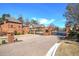 Gated community entrance showing beautiful brickwork, manicured landscaping, and secure access for residents at 2160 Kensington Gates Nw Dr, Kennesaw, GA 30152