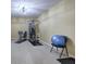 Home gym featuring exercise equipment, neutral carpet, and a well-lit space for fitness activities at 2160 Kensington Gates Nw Dr, Kennesaw, GA 30152