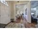 Welcoming foyer with hardwood floors flowing into dining and living spaces at 2160 Kensington Gates Nw Dr, Kennesaw, GA 30152