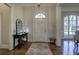 Bright foyer featuring hardwood floors, arched doorways, and console table at 2160 Kensington Gates Nw Dr, Kennesaw, GA 30152