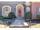 Inviting front entrance with arched doorway and decorative wreath at 2160 Kensington Gates Nw Dr, Kennesaw, GA 30152